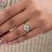 A Women wearing Hexagon Blue Diamond Halo Engagement Ring 