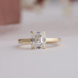 emerald cut diamond cathedral engagement ring