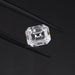 exlclusive emerald cut loose diamonds holded with tweezer 