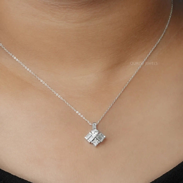 trillion diamond pendant featuring baguette and princess cut diamonds