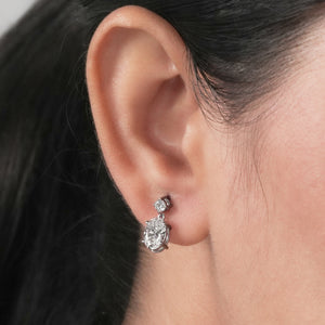 round and oval diamond drop earrings in white gold