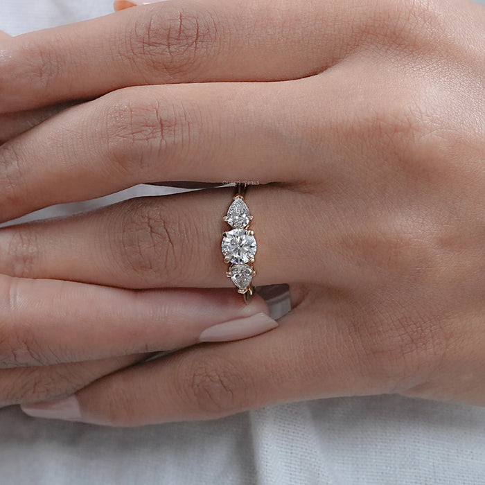 Round and Pear Shaped Diamond Three Stone Ring