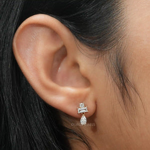 [A Women wearing Pear and Baguette Diamond Earrings]-[Ouros Jewels]