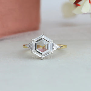 Three Stone Engagement Ring with a Hexagonal Step-Cut Diamond