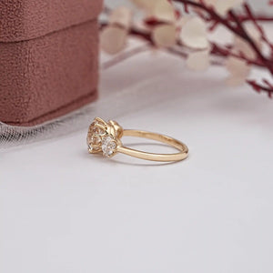 round diamond three stone engagement ring in yellow gold 