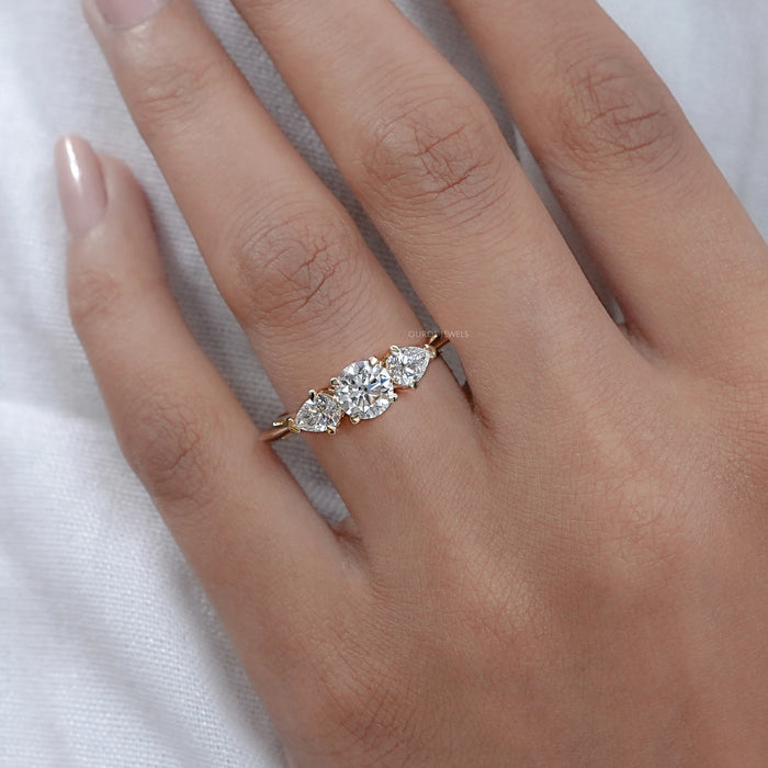 Round and Pear Shaped Diamond Three Stone Ring