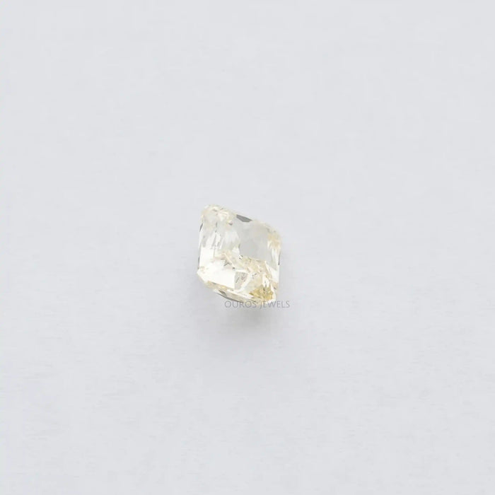 2.15 Carat Fancy Intense Yellow Radiant Cut Lab Diamond displayed on white surface.