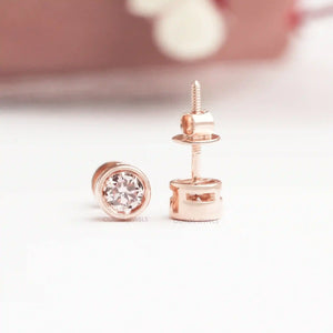 Bezel Set Diamond Stud Earrings in rose gold, featuring a front and side view with a secure screw back design and sparkling round diamonds