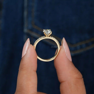 [ a women holding a solitaire accent diamond ring]-[Ouros Jewels]