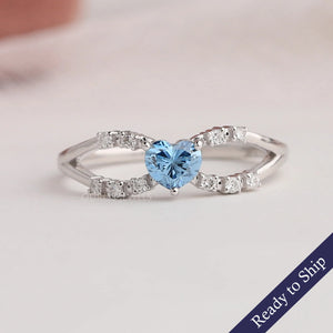 Blue heart lab grown diamond infinity ring with spilt shank and round accent stones