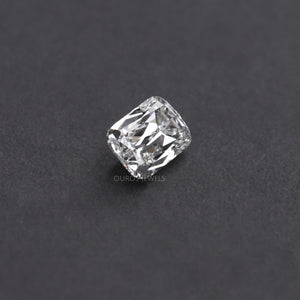 A close-up of a 2.23 carat IGI certified criss cut lab diamond. The diamond is white and has a brilliant cut. It display on a black surface