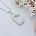 C initial pendant with round diamonds