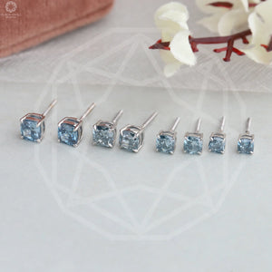 Blue Cushion Diamond Studs, displayed side by side with different sizes