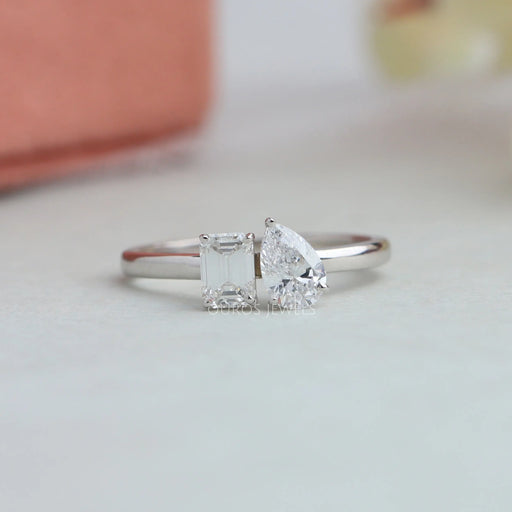 pear and emerald cut diamond two stone ring