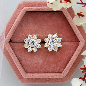 floral shape halo earrings with round diamond as center stone